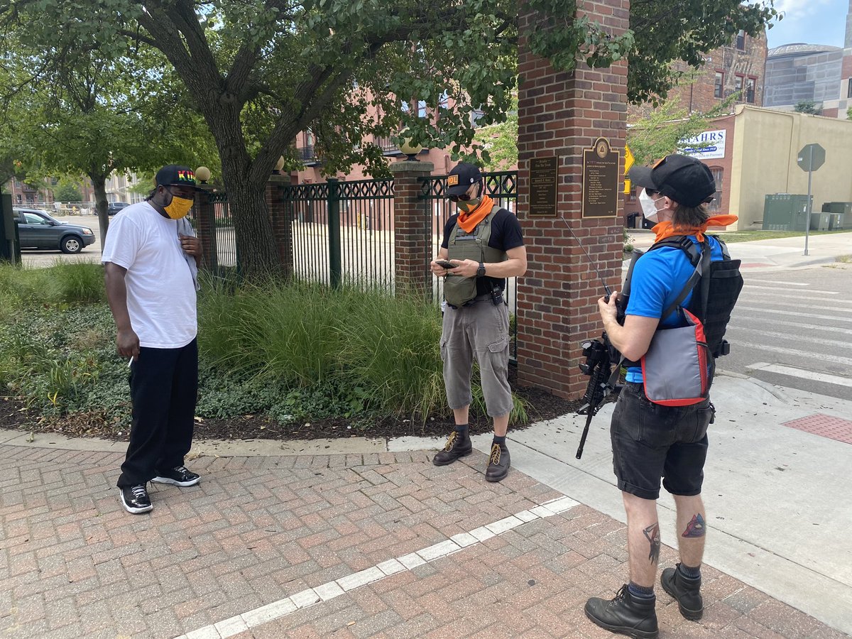Community members are interacting with members of the anti-racist group; they don’t talk to media but did tell me some of them are Kalamazoo residents and some are from out of town. The group has an armed perimeter around the area.