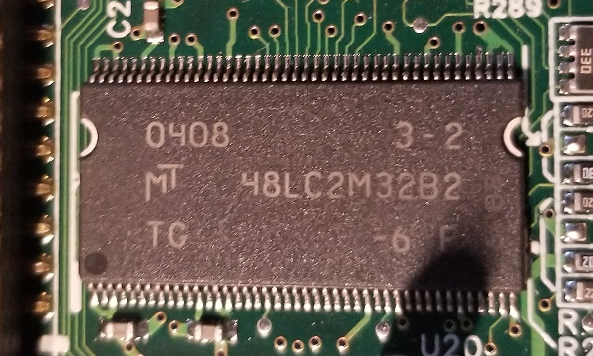 This chip here is an MT48LC2M32B2. That's a Micron DRAM chip, 8 megabytes.So this is probably VRAM for the video chip.