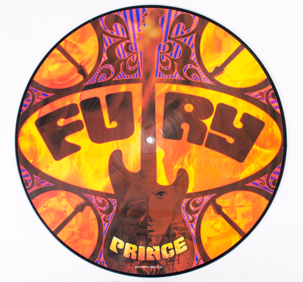 Side Note A: did anyone think it strange for Prince to have a Strat as the cover design for "Fury's" single release? It is, until you realize that "Fury" is really a vehicle for his guitar playing. The lyrical content is secondary; in fact, there's no chorus – only soloing.