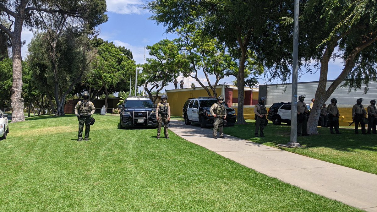 AARF_LA's tweet photo. We're here at the East LA Sheriff's Department for the #JusticeForAnthonyVargaz protest. Police are lined up in riot gear. https://t.co/tGouDj7l6g