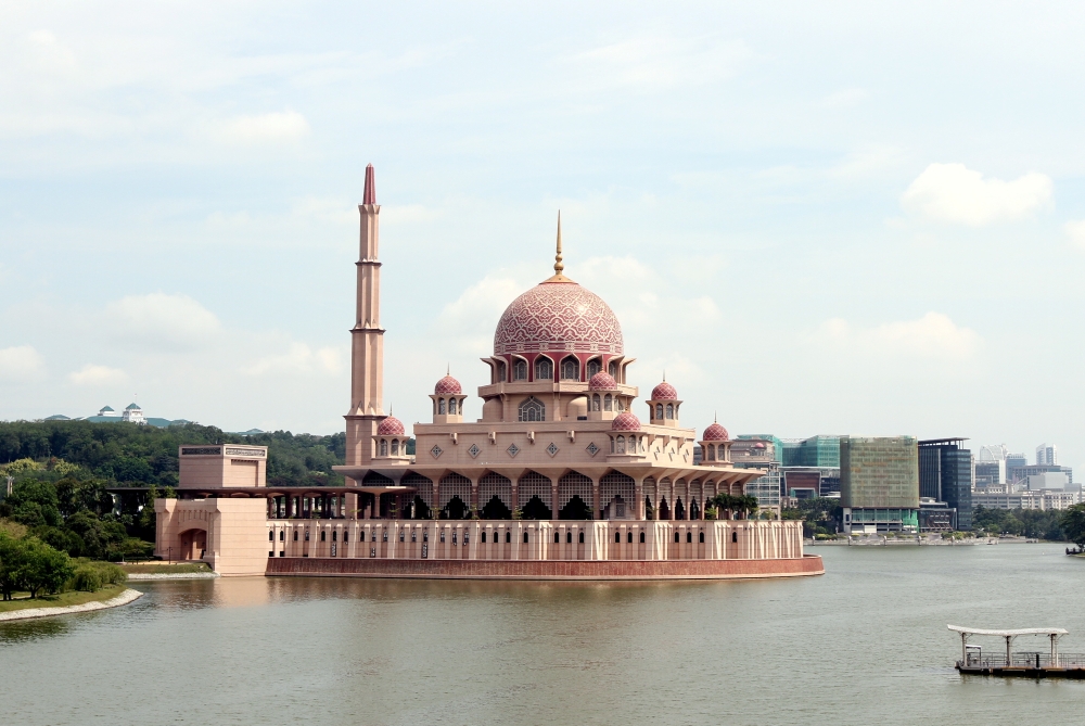 PINK: Entering into Malaysia, our fatigue takes the best of us. Laying down at Putra mosque, a clear sky above becomes our blanket. We gently fall asleep to the delicate sound of waves meeting brick.