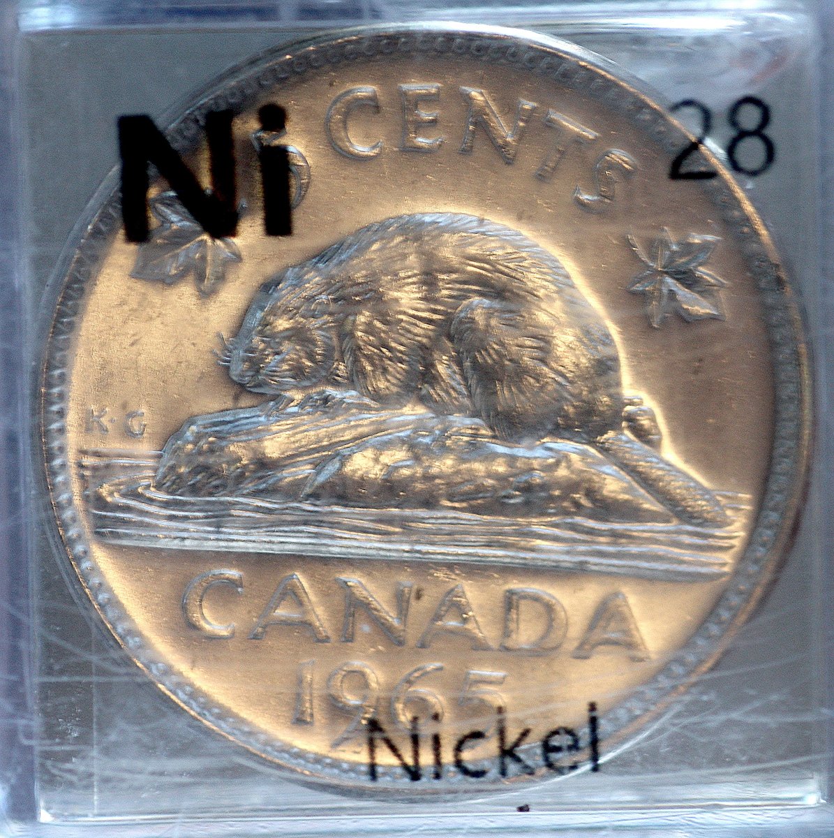 Nickel  #elementphotos. Coin is a relatively rare example of a pure nickel coin. Green compound is nickel sulphate (NiSO4.6H2O).