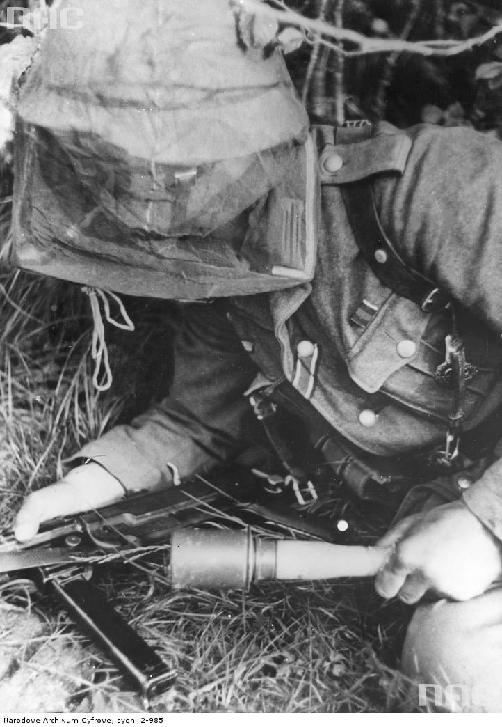 Nice close up of detail you may not know & which helps me estimate dates.First, the feldgrau collar & scalloped/pleated pockets identifies a M40 tunic. He wears silver collar tresse of a NCO, but then 1943 subdued grey/blue tresse on his shoulderboards, denoting Ufwl.20a)