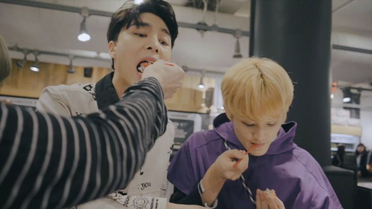 taeyong feeding johnny with (honestly idk) ice cream?