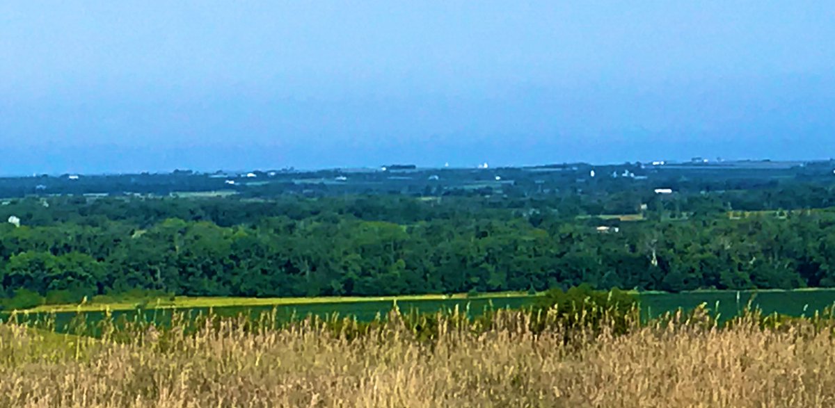 Look out from Lost Rail’s stunning clubhouse ridge and you’ll see grain elevators and radio/TV towers.But most notable is the unusually large number of water towers in the distance. How many? And how far away? 3/