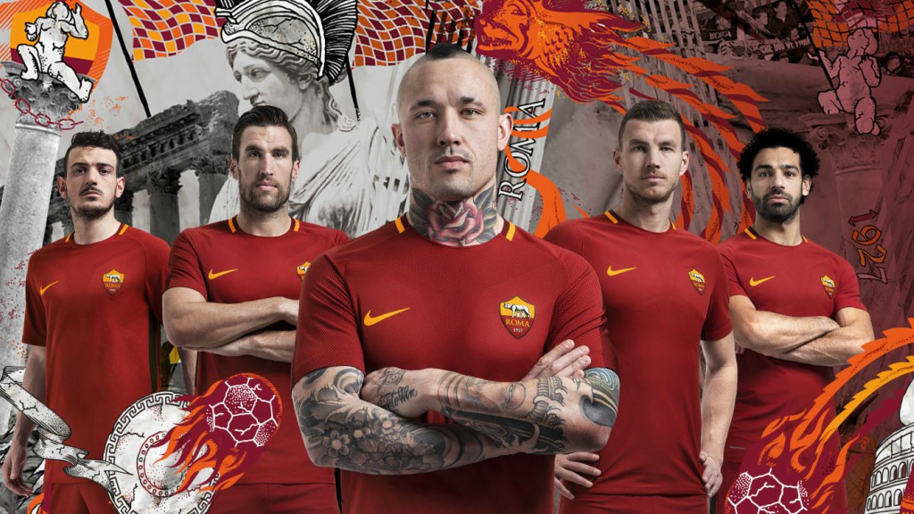 La home de la temporada 2017/2018 era roja con detalles amarillos en el cuello y megros en las tiras laterales.En el interior del cuello aparecia el caracteristico jocktag de "Roma Siamo Noi" (Nosotros Somos Roma).