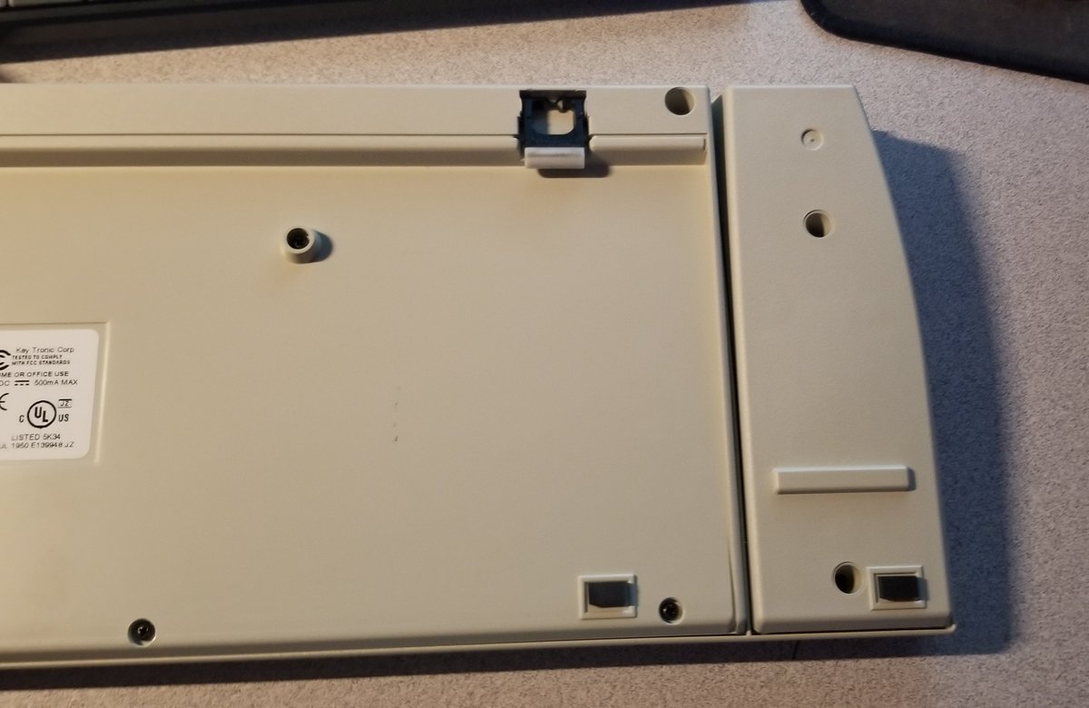 Looking at the bottom of the keyboard, you can see that they built this VERY MUCH on top of an existing Key Tronic keyboard.It seems to be the back plate + mechanism of another keyboard, with a reader part jammed on the side, and a new top-mold to hold it all together.