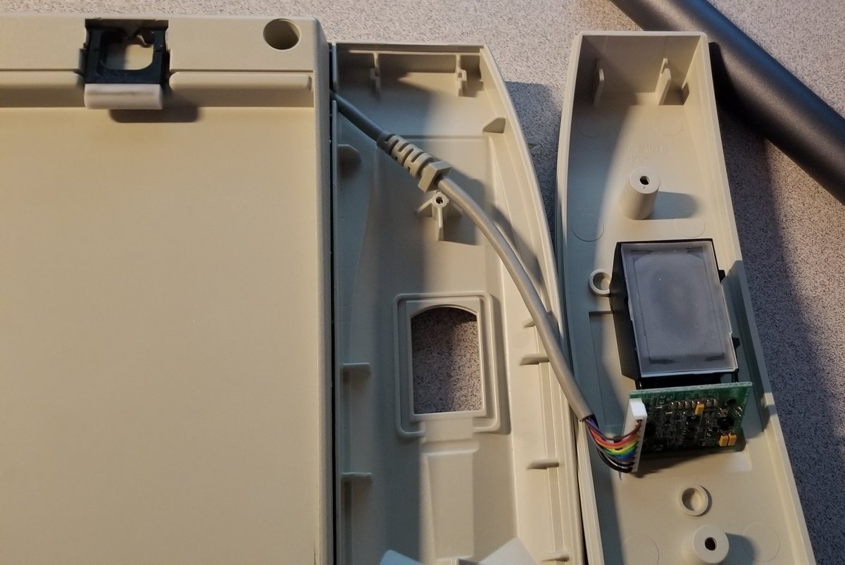 Let's open up the scanner.Amusingly it has a little strain-relief built into the cable, despite not needing it at all.They clearly just used the same internals as a stand-alone fingerprint scanner