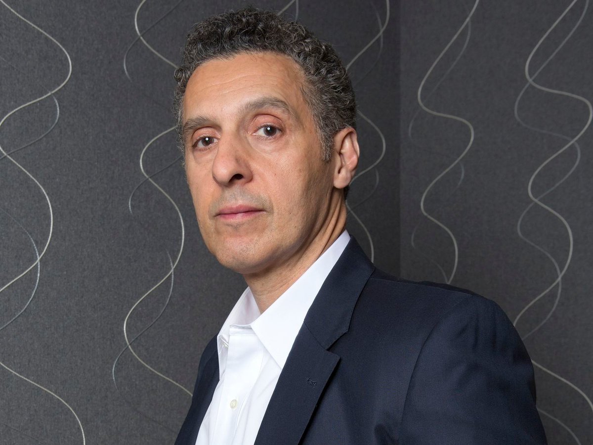John Turturro - Carmine FalconeThis needs to be talked about far more, as this is brilliant casting. Turturro is a master at his craft, and has a massive, colorful career. His range is undeniable. HBO dramas to Adam Sandler comedies, whatever he wants to do, he can do.