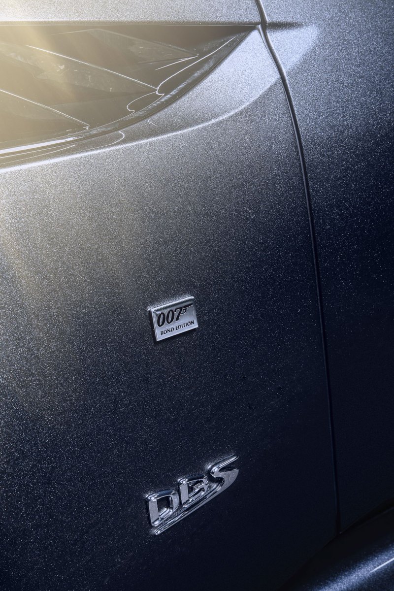 astonmartin's tweet photo. The 007 Edition DBS Superleggera features a @007 fender badge, finished in chrome with a black enamel infill, and Stainless Steel Silver 007 foil applied to the rear spoiler blade.

#QbyAstonMartin #NoTimeToDie #LicenceToThrill https://t.co/lIRrnek0Ce