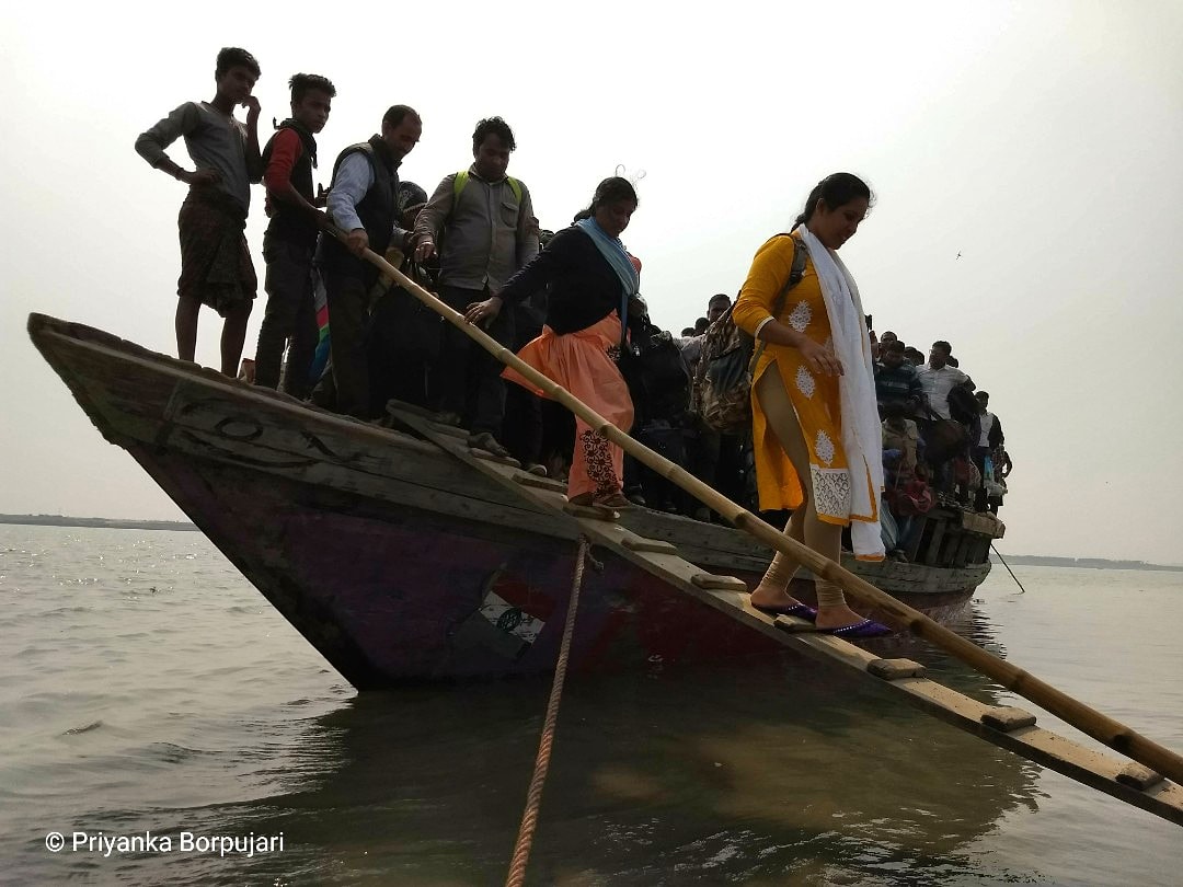 A tricky pause before the shore. Then, a wobble.Arrival, finally.Disembarkation is a delicate ballet of shifting weight.Dhubri Bazaar, Assam.The story of movement of people across space is also the story of risks & chances. On the  @outofedenwalk  #EdenWalk with  @PaulSalopek