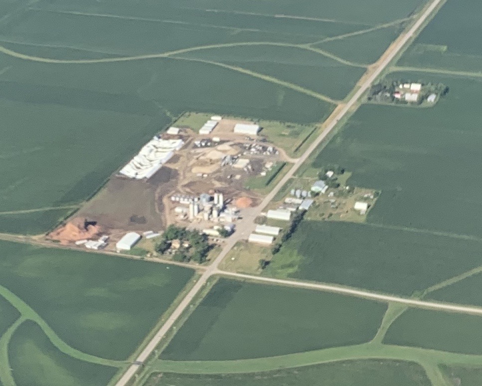 Before long, I started to see obvious damage from the previous days storms, with debris fields extending - all in the same direction - from destroyed and/or damaged structures on some of the farms below. This pic shows what looks like major damage to a structure (left side).