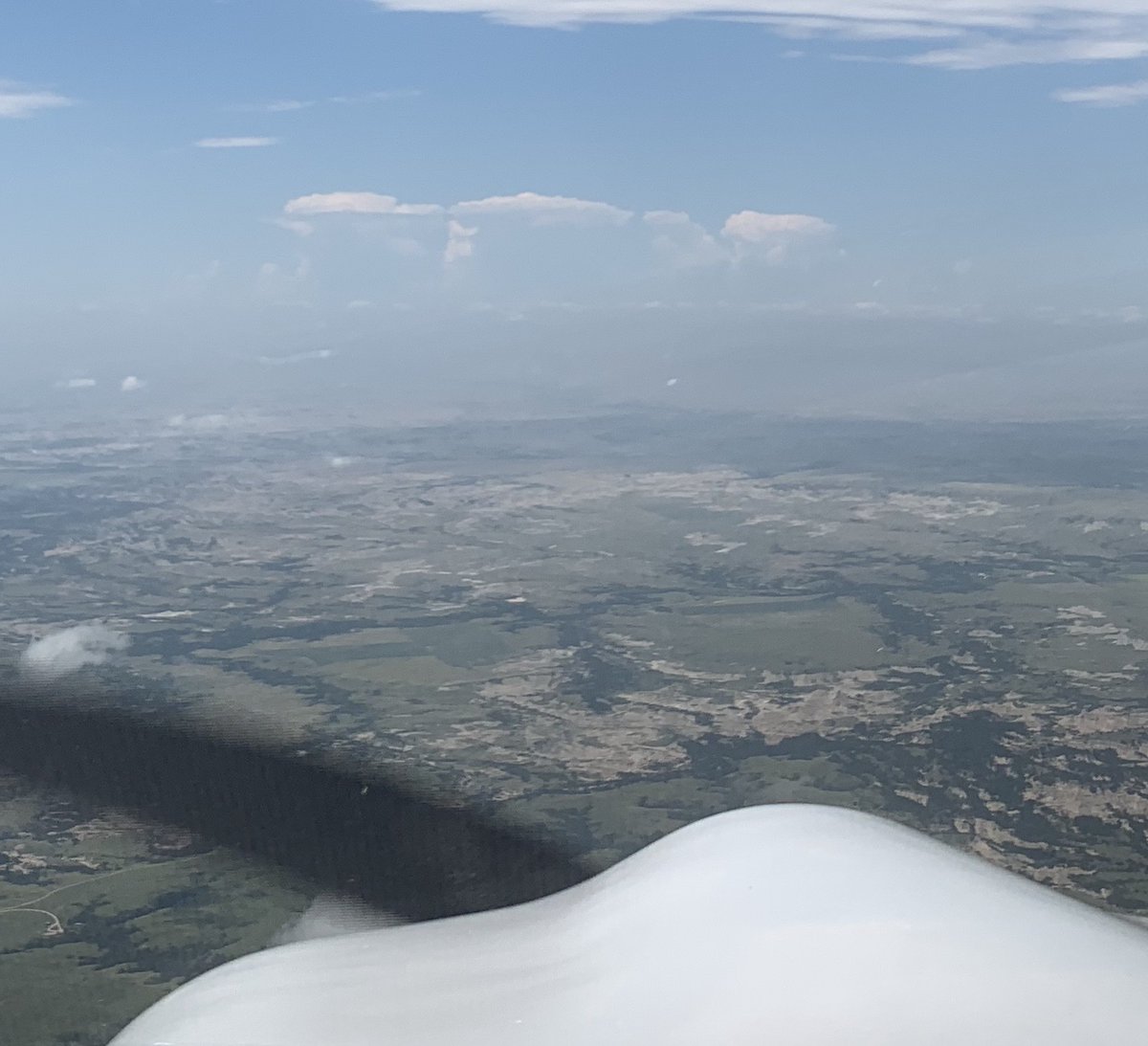 As I approached Rapid City, I could see where the Black Hills were from 50+ miles away, with towering cumulus clouds caused by was probably lifting action from the hills' higher elevation. The cells caused me no trouble on my approach, as the rain didn't even reach the ground.
