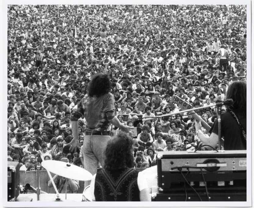 writingpis's tweet photo. Joe Cocker #Woodstock photo I gave PI-hub for Xmas a few years ago (takes up a chunk of our kitchen wall). Very similar to #LSUG's pic below (almost identical tie-dye &amp; jeans), but pretty sure not Cocker as he didn't play any instruments. https://t.co/KAJRggmtcP