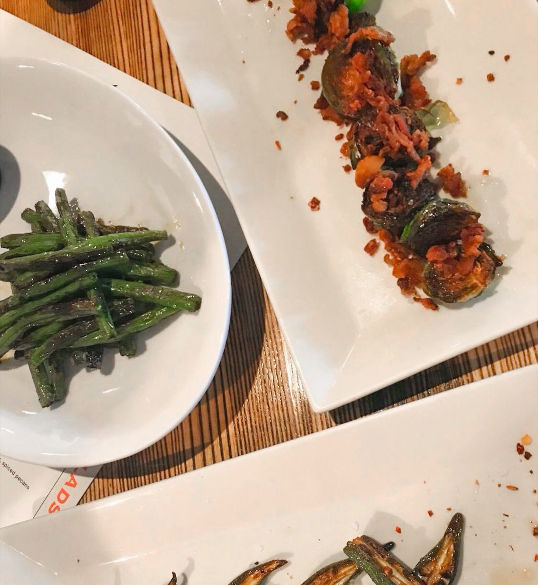 Now *this* is how we like our veggies: green beans w/house-made ranch, Brussels sprouts topped with crsipy bacon and balsamic + okra and red pepper flakes. 😎 Making dinner out of appetizers, dining in-house or at home, is #ZasOnDevine approved.