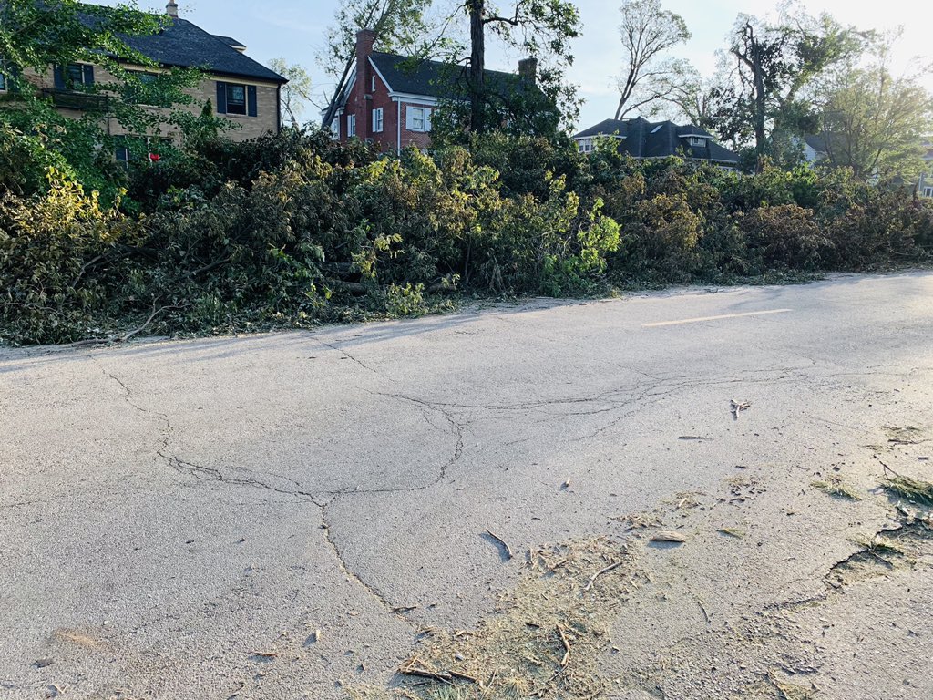 Typically you’d see quaint homes and well manicured lawns from the street. Now every stree has wood and debris piled ten foot high or more. It’s like this not on a street, here and there. It’s like this everywhere.