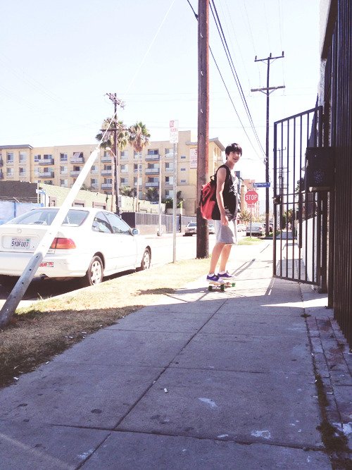 when i was riding my skateboard in front of the practice room, my teacher snapped this shot. i look like an idiot.the skateboard is a beginner's board. -ㅂ-(who's gonna tell him he looks adorable?)