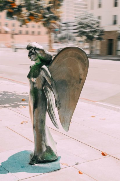 FIDM's tweet image. Ever wondered what the masked angel statue on the #FIDMLA Campus means? The piece was created in 1990 and is titled &quot;Transforming Yourself Into Fashion.&quot; It depicts that in LA, many people try to change their image, masked in mystery. #FIDMFact