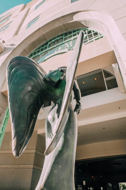 FIDM's tweet image. Ever wondered what the masked angel statue on the #FIDMLA Campus means? The piece was created in 1990 and is titled &quot;Transforming Yourself Into Fashion.&quot; It depicts that in LA, many people try to change their image, masked in mystery. #FIDMFact