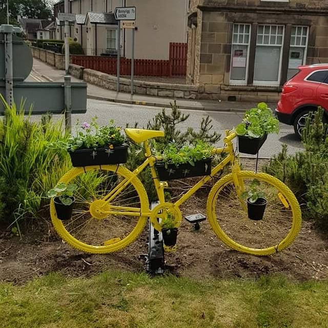 onedalkeith's tweet photo. One Dalkeith's "Decorate a Tired Old Bike" project has been a great success so far, with these bikes and more popping up all over the town, thanks to the inspiring efforts of individuals and organisations like Eskvalley Rotary and Dalkeith Guerilla Gardeners #doingitfordalkeith. https://t.co/ZlAkrnrzDz