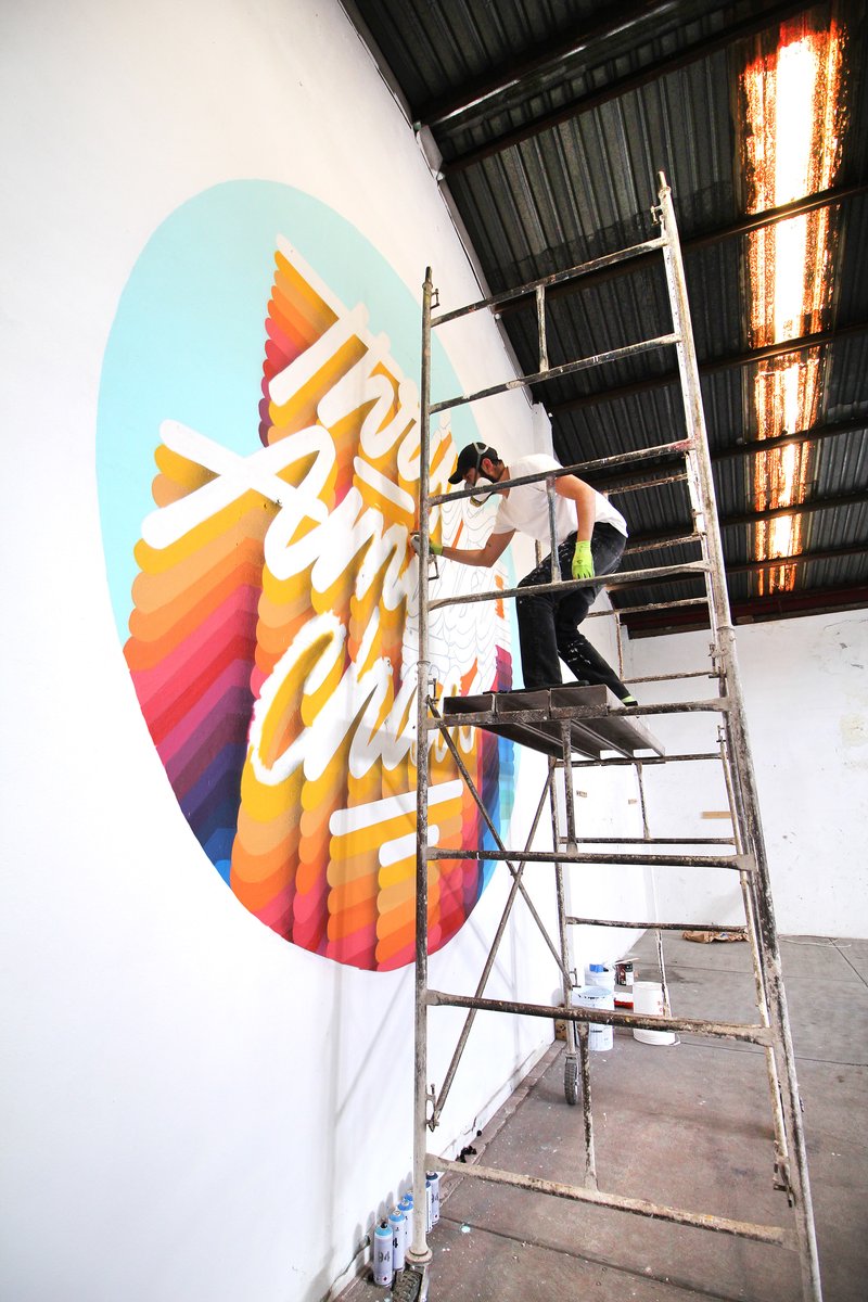 Adobe's tweet photo. In the midst of isolation, designer @its_a_living keeps positivity front &amp; center with mural art. Follow along the journey from start to finish: https://t.co/ay6rgZGBaD https://t.co/sHOhIsZ7Vc