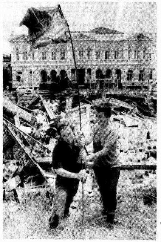 here's Michael Redford and Susie Brown of the Unemployed Workers Union, opposite Northcote Town Hall, waving a flag in the rubble of their headquarters. some UWU members lost all their possessions in the demolition (The Canberra Times, 23 Nov 1983) https://trove.nla.gov.au/newspaper/article/116396998