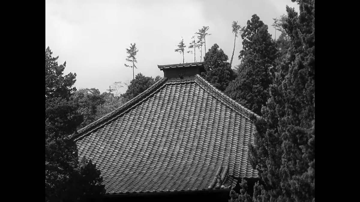 The final person-free establishing shot is of the top of Kenchoji, the oldest zen temple in Japan, a clear introduction of the theme of tradition for Japanese audiences. It's also where the tea ceremony in the first scene will take place.