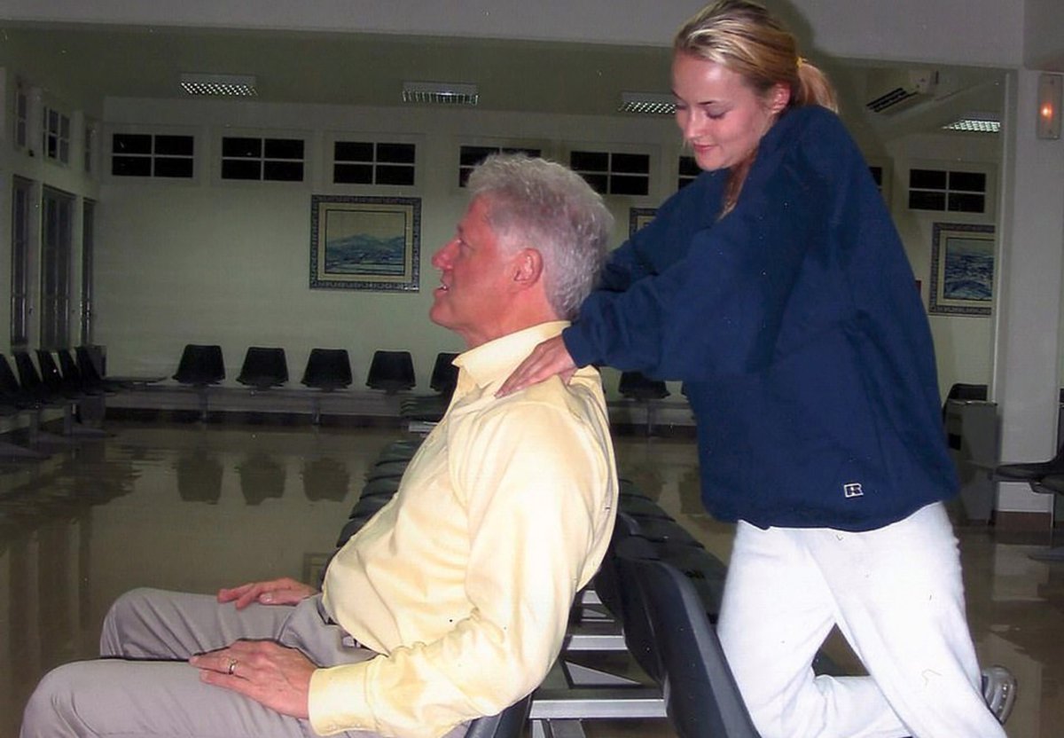 Former POTUS Bill Clinton getting a massage at the airport by a