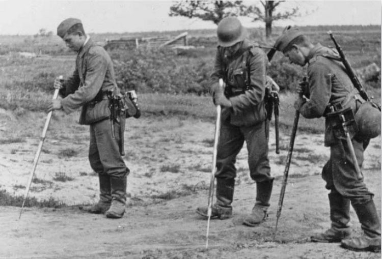 Okay, a thread on a subject I know little about, but became intrigued after seeing this pic last year - anti-personnel & anti-tank mine detection with a stick.It became apparent to me that these 3 landser were probing for mines, with seemingly makeshift wooden poles.1)