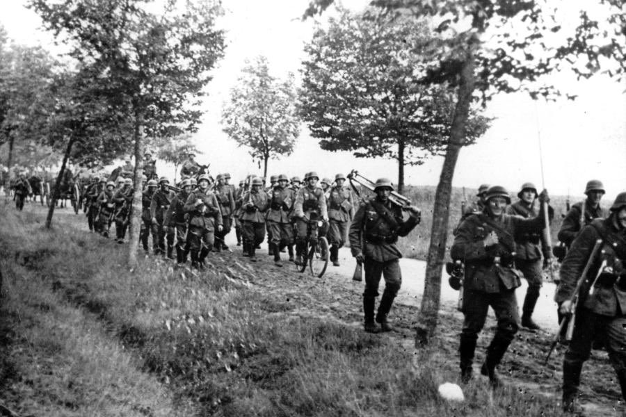 And from the German viewpoint, here’s the last pic I’ve found so far.See the chap 4th from right. I think he’s holding a similar pole, too.If so, it suggests this rudimentary piece of kit was perhaps part of each Zug (Platoon) informal toolkit re mine detection.6)