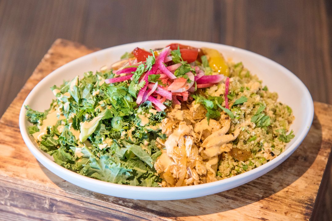 Celebrate #NationalFajitaDay with our Summer 2020 Better For You Bowl - Paleo Chicken Fajita! Shredded picante chicken, peppers &amp; shallots, paleo rice, fresh kale tossed in zesty lemon, pickled watermelon radish &amp; vegan nacho aioli. What are you waiting for? Try it today! 🌶