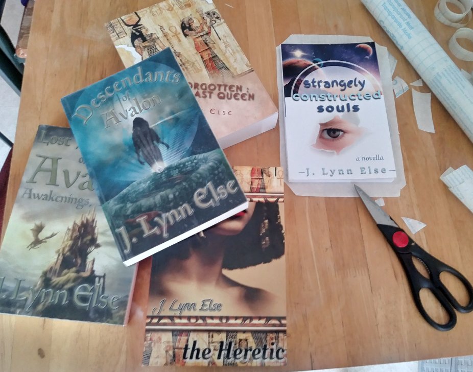 JLynnElseAuthor's tweet photo. Getting some display copies ready for a local author event. I forgot how tricky contact paper was! So many bubbles and fingerprints...
#writerlife #books #bibliophile #author #amwriting #inklingspublishing #contactpaper #quarantinelife #YAFantasy #HistFic #ancientEgypt #scifi https://t.co/pGYppOJ4Dx