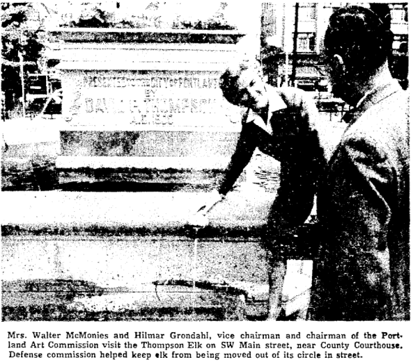 Despite being in the middle of the street, surrounded by cars, and no longer having any horses to give water to, the elk was allowed to stay on its pedestal.