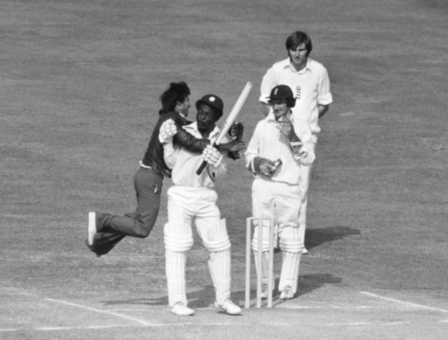 Alan Knott looking at the mauling that Roy Fredericks is getting from a fan and thanking his stars that he didn't get to his hundred here.