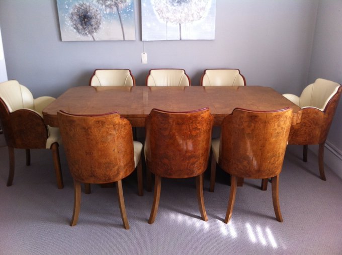 Epstein Brothers Art Deco dining table in burr walnut with eight cloud back chairs and cream leather upholstery, for sale at E & A Wates.