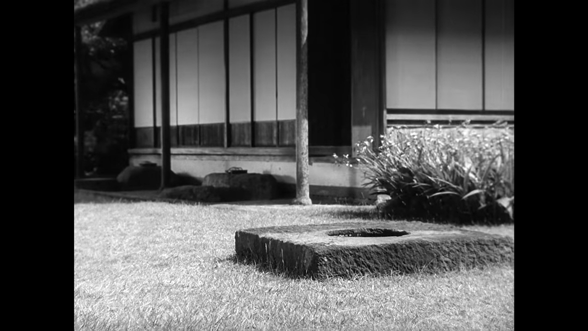 We are back outside, this time from the opposite side – note the sandals, which were in the first pillow shot outside the temple. The shot also includes the plants from the second pillow shot and the post from the third.