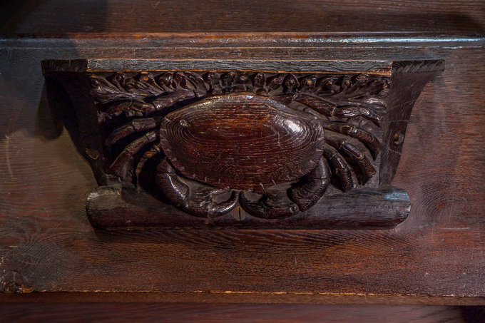 A crab lurks under a misericord in the Quire of  @durhamcathedral  #AnimalsInChurches  #AnimalsInCathedrals