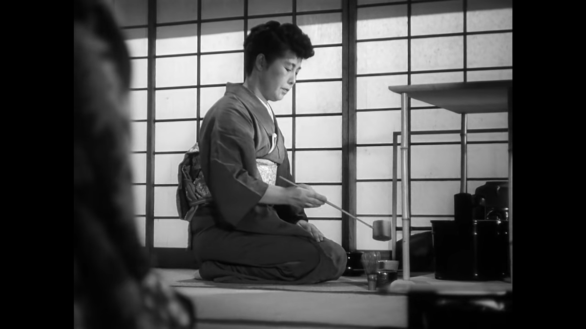 Ozu spends quite a bit of time on the tea making; to cut from this moment at any point would be counter-intuitive considering the process and its careful use of time is precisely the point. Note the awesome ladle and matcha whisk – tea making is fun!