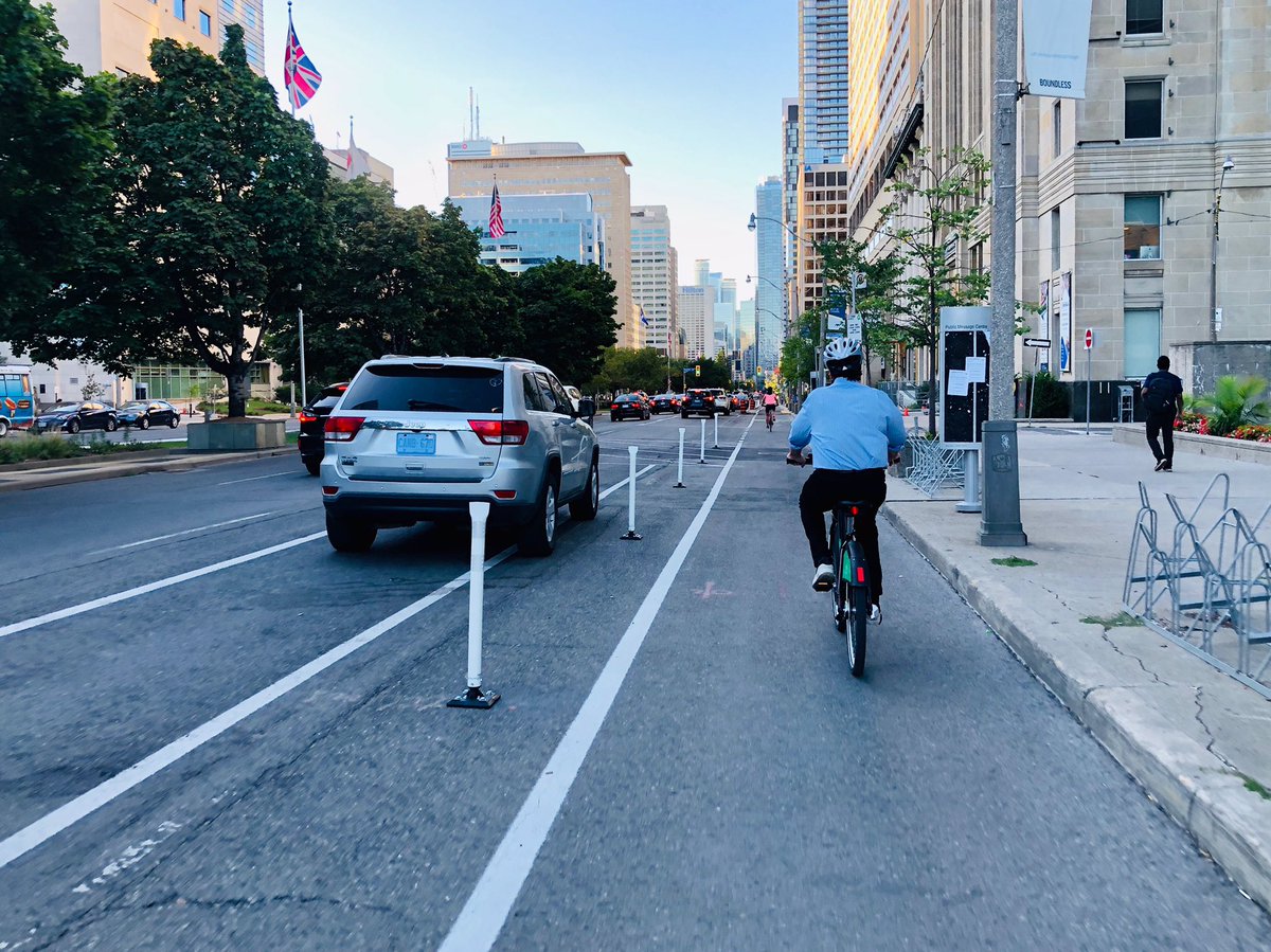 JohnTory's tweet photo. Had a great commute to work this morning using the new bike lanes on University Avenue. Cycling is a key part of our city’s transportation network and this safe, separated #ActiveTO cycling route will give residents more ways to safely get around our city. https://t.co/YXFNYwyWfE