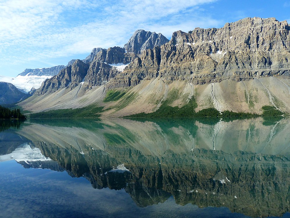 Anna_Dillon's tweet photo. The mirror of Bow Lake in Jasper National Park which covers over 11,000 square kilometres and is part of the UNESCO's Canadian Rocky Mountain World Heritage Site. I took this early in the morning in 2013 on route to the Columbian Icefields. #dailylandscape #WorldPhotographyDay https://t.co/2u7zU5wAbW