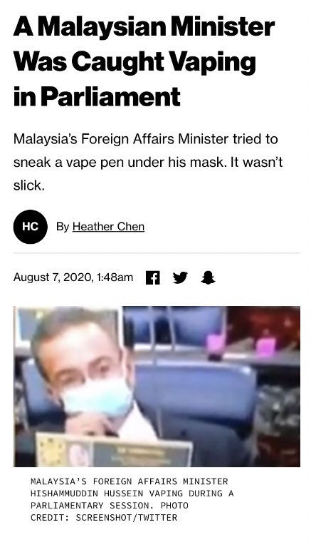 Foreign Affairs Minister, Hishammuddin Hussein, vaping in parliament, in violation of no smoking rules.