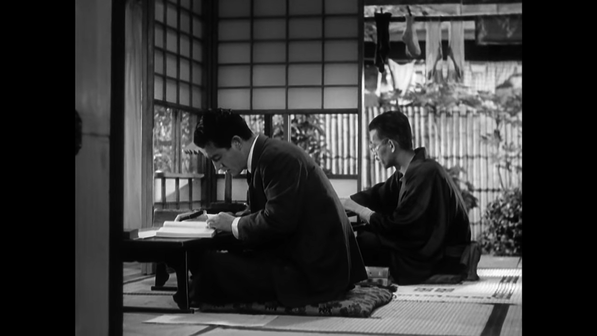 Here is our first shot of Chishū Ryū as Shukichi, Noriko’s father, here sitting next to Jun Usami. This is also our first look at the home he shares with Noriko. Note we meet Noriko in a traditional setting while Shukichi is introduced studying European economics.
