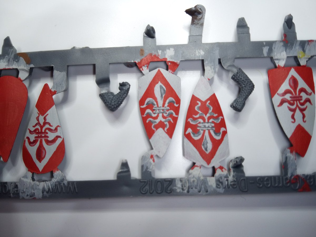 And finally add a lighter shade, this defines the shape, especially the horizontal bars. These took about 90 minutes from start to finish(shields were already primed). I hope this helps