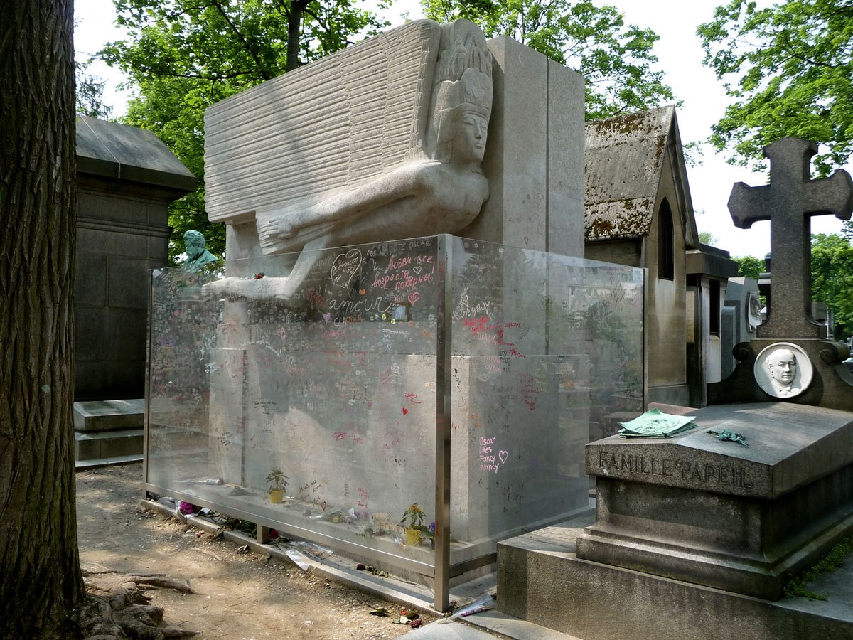 Some time in the '60s, the angel's genitals were smashed off. Urban legend has them being used as a paperweight in the Père Lachaise office, but who knows. The tomb remains with only a little stump (and an ugly barricade to try to prevent the smooching).