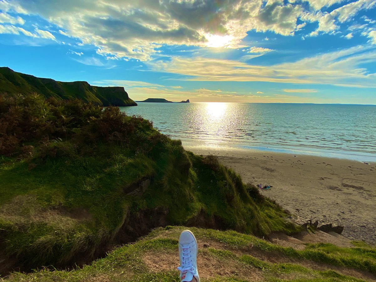 Rhossili Bay, Gower Peninsula, Wales.  When tide is down, you can see also the wreck of the Helvetia, a Norwegian ship sunk just here in 1887 during a storm.Down the beach there’s the Veil, one of last examples of fields still parted like in the Middle Ages. #staycation 