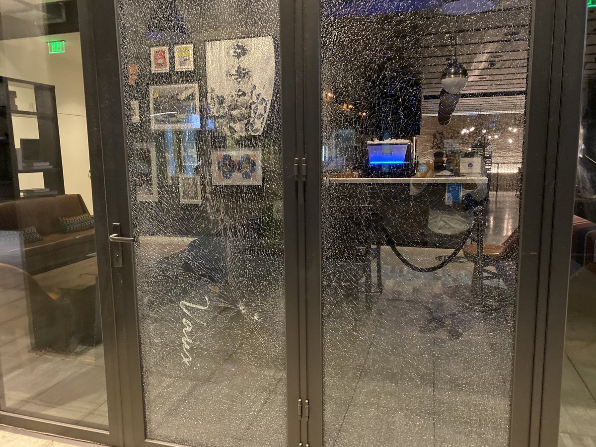 It looks like pellets or something was shot at windows at a hotel near wheelers condo