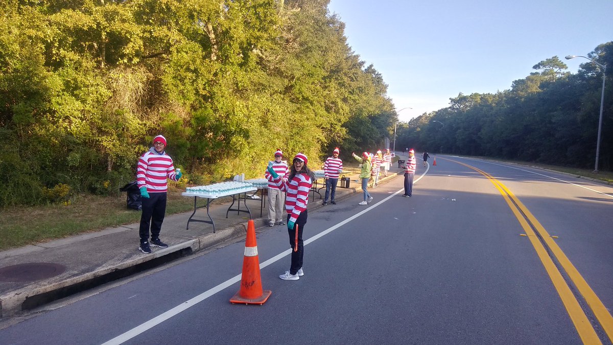 11/ The people at the water station saw the kids and me waiting and asked why we were there (at the 1/4 mile point in the boonies) so we told them her story. They called a meeting and planned to cheer for her when she came by. (They were all dressed as “Where’s Waldo”)