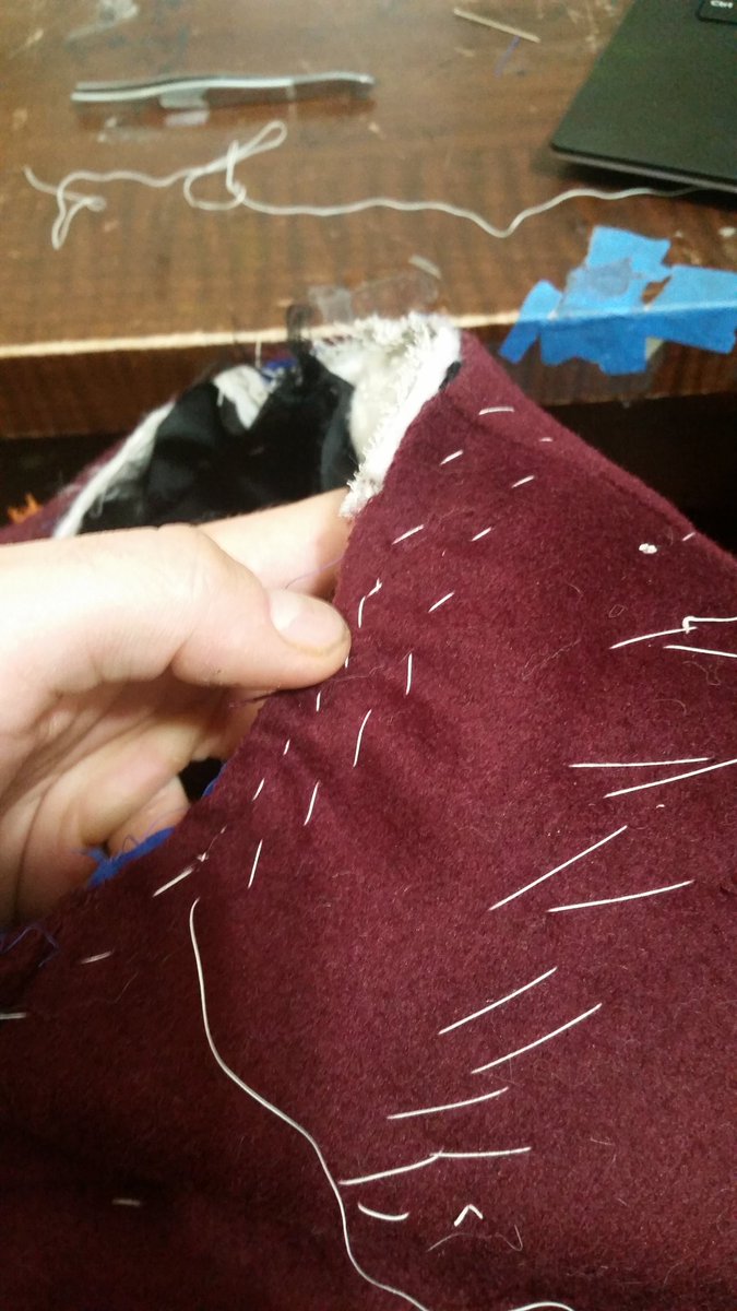 Oh my god, yes, more basting, this time a strip of pocketing to keep the armhole from stretching. Second pic also show the ease stitched in to the shoulder area--I'll steam those ripples out next.