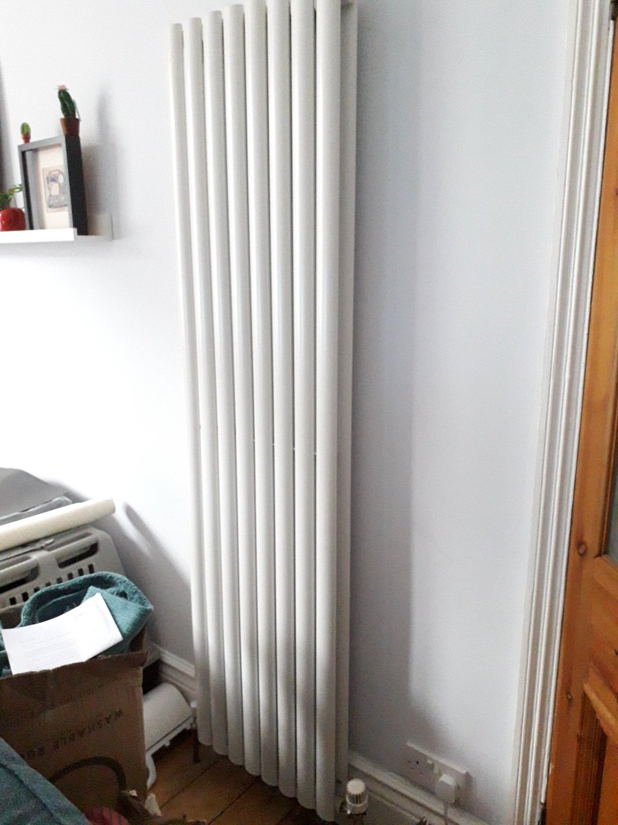 We keep skateboards and bike pumps in it. So because kids it's not unusual to find it open.So we close it.Anyhow, one day my wife announced she wanted a new radiator in the lounge.Something fancy and new.So we got one and I plumbed it in. Here it is...