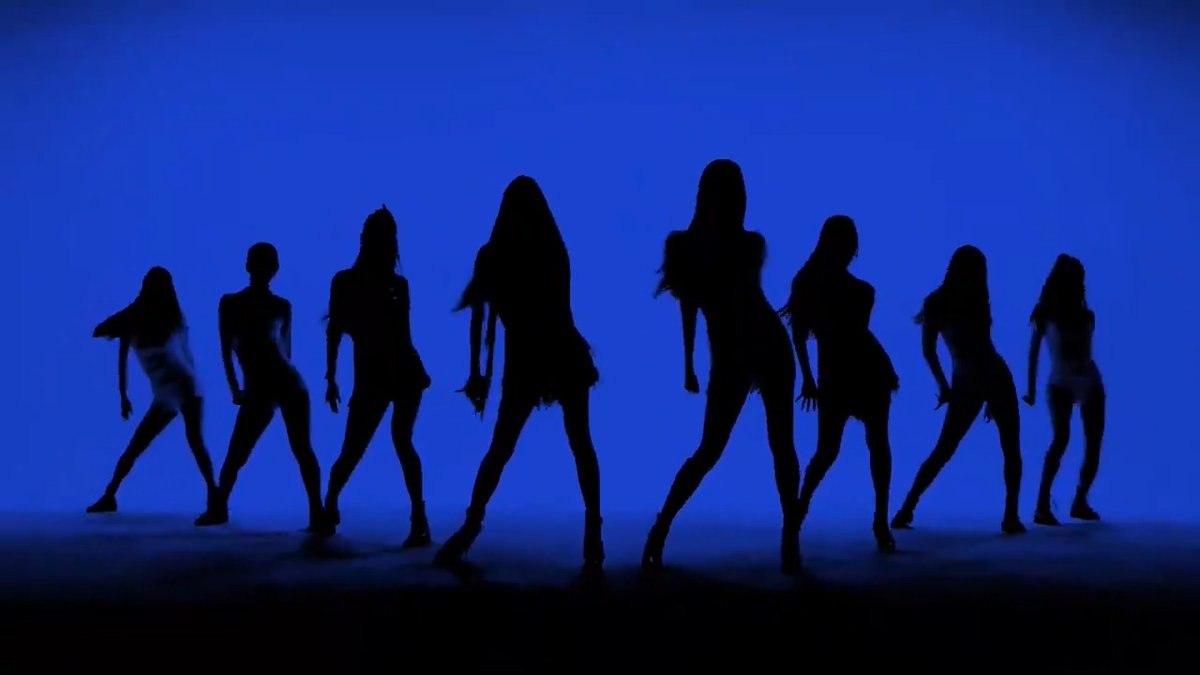 Silhouettes of eight dancers in dynamic poses against a vibrant blue background.